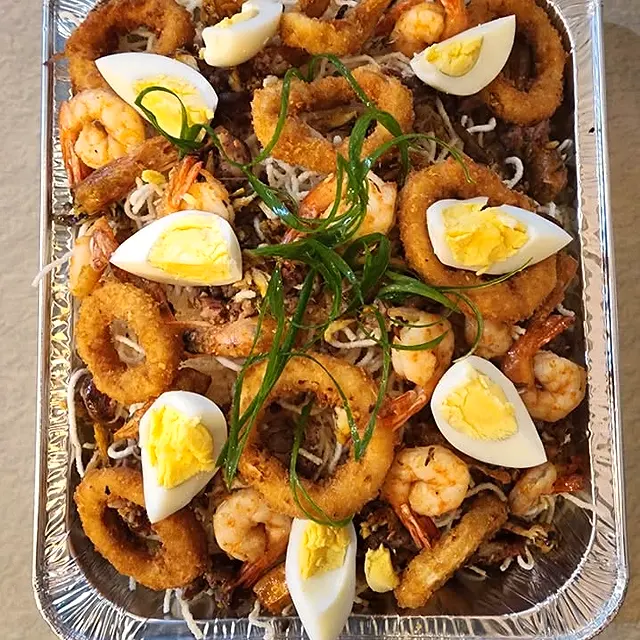 Party tray of seafood with squid rings, shrimp and boiled eggs